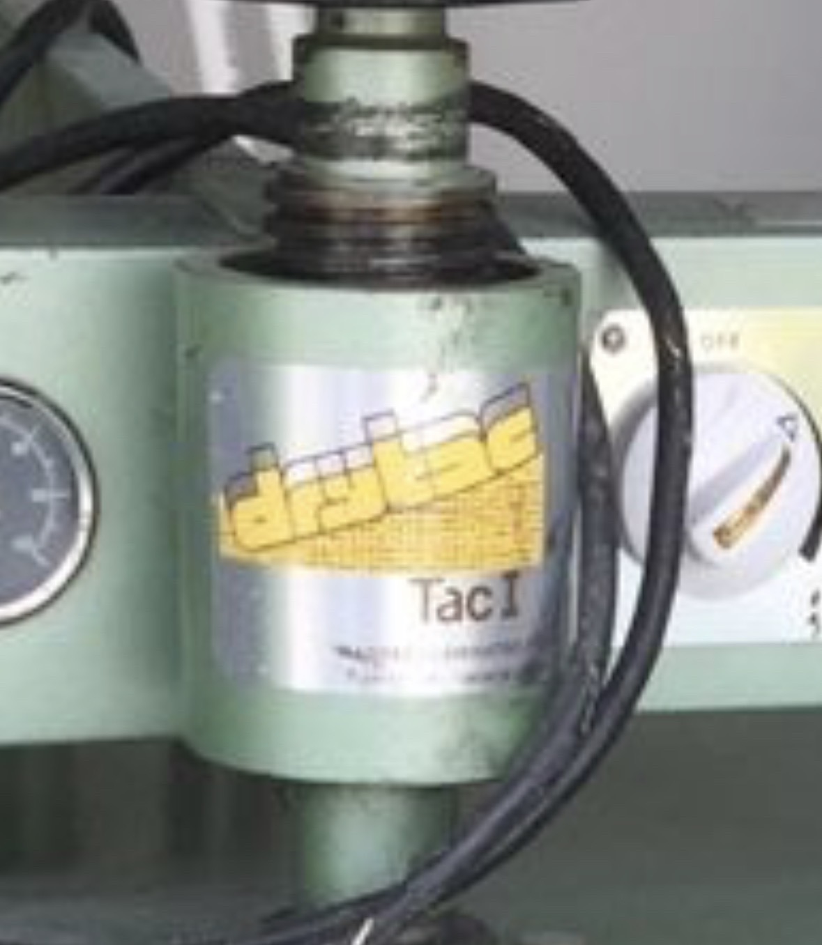 Early Drytac TacI machine with the original hand-drawn logo