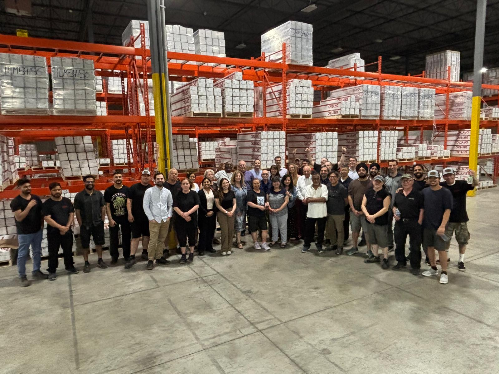 Drytac full team gathered in the warehouse